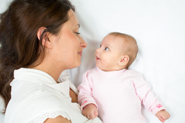 Happy,Mother,And,Her,Baby,Girl,Looking,Each,At,Other
